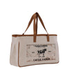 A beige canvas tote bag with a printed design on it, featuring a cow and the text "Grassmere Cattle Ranch Est. 1950".