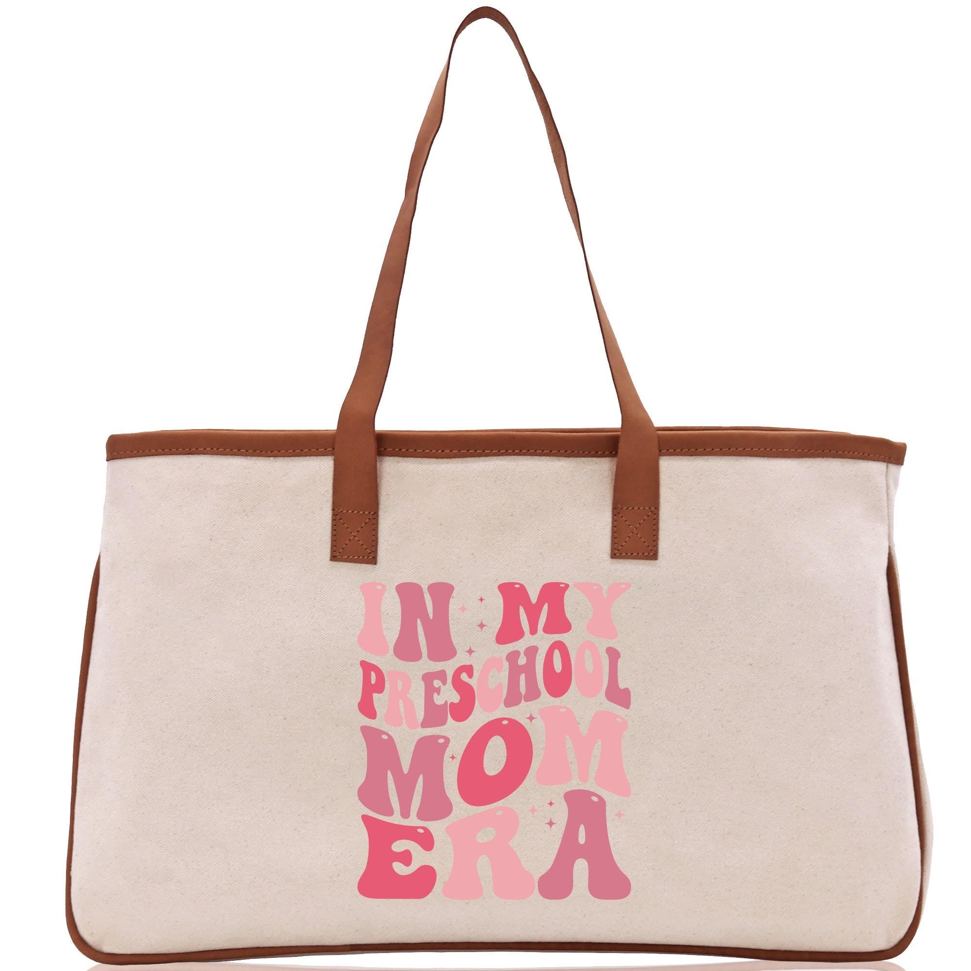 a white bag with pink writing on it