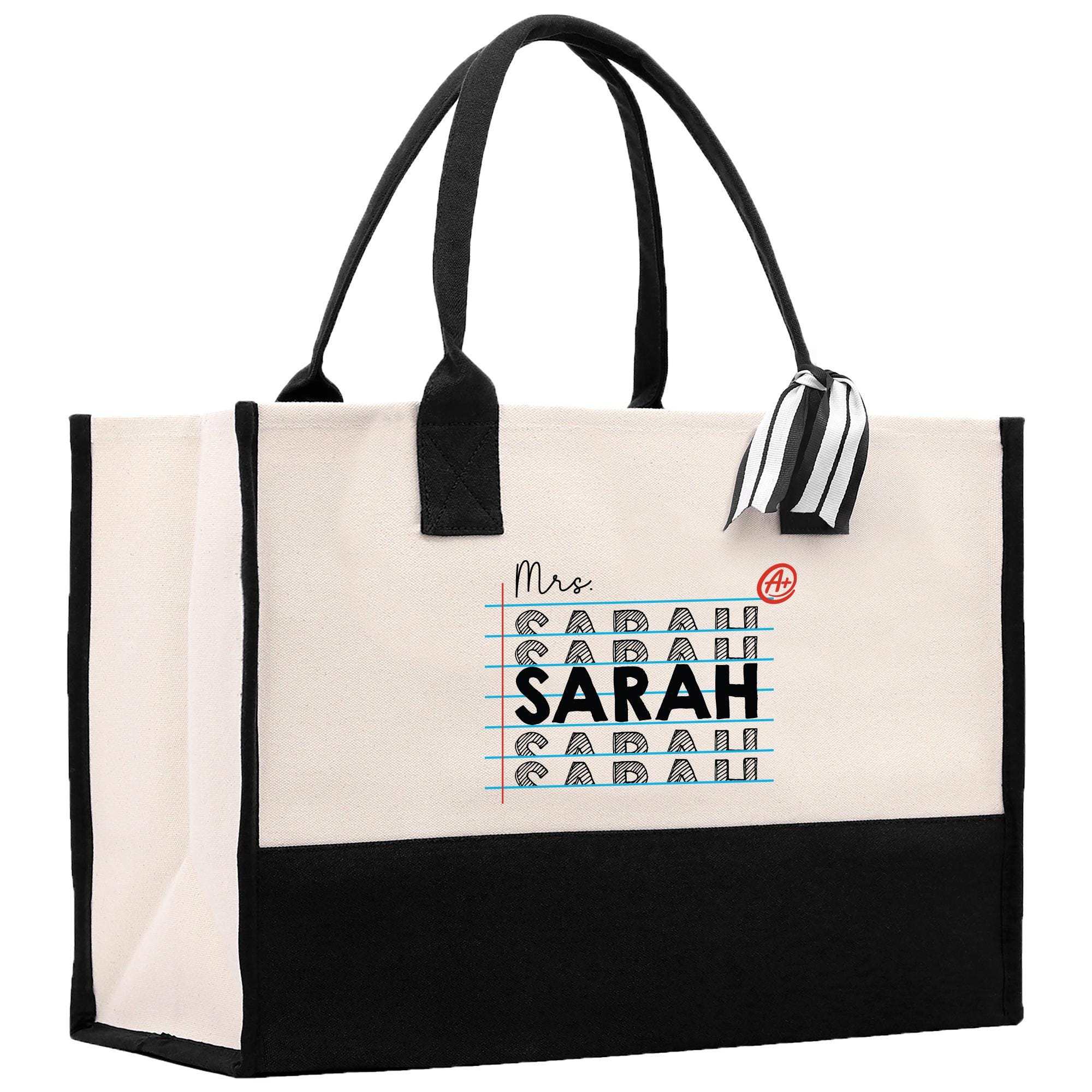 a white and black bag with a black handle