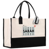 a white and black bag with a black handle