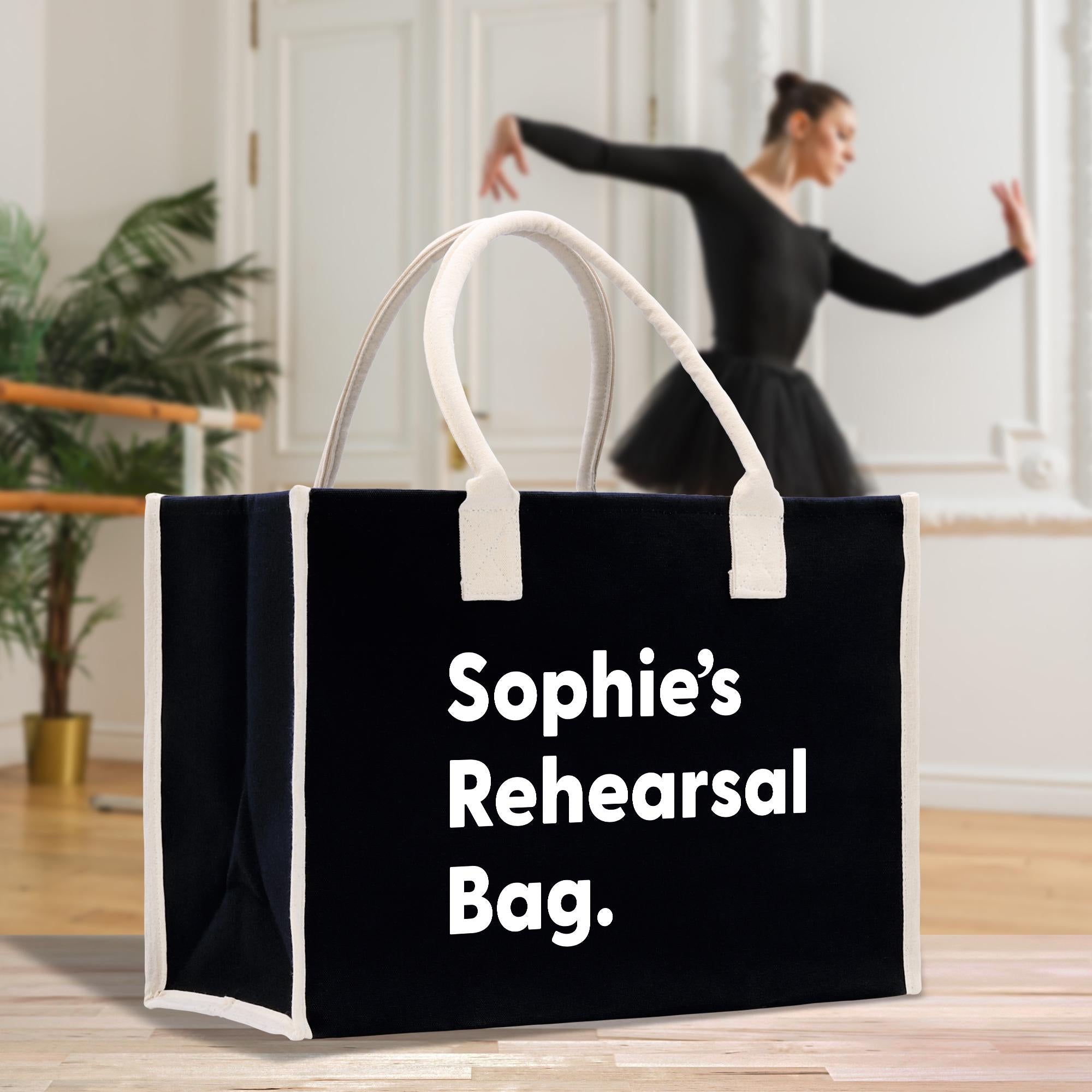 a woman in a black dress is dancing with a black and white shopping bag