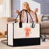 A woman is sitting on a couch, holding a phone, and a large tote bag with a perfume bottle design is placed in front of her.