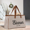 a canvas tote bag with a leather handle