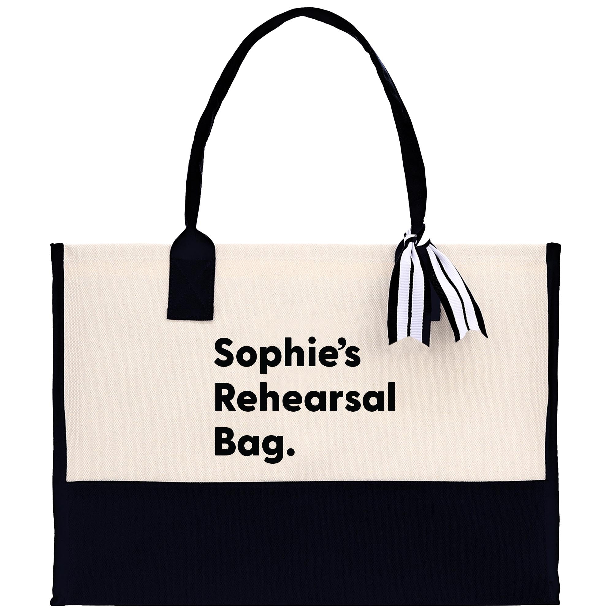 a black and white bag with a black and white striped handle
