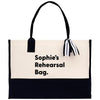 a black and white bag with a black and white striped handle