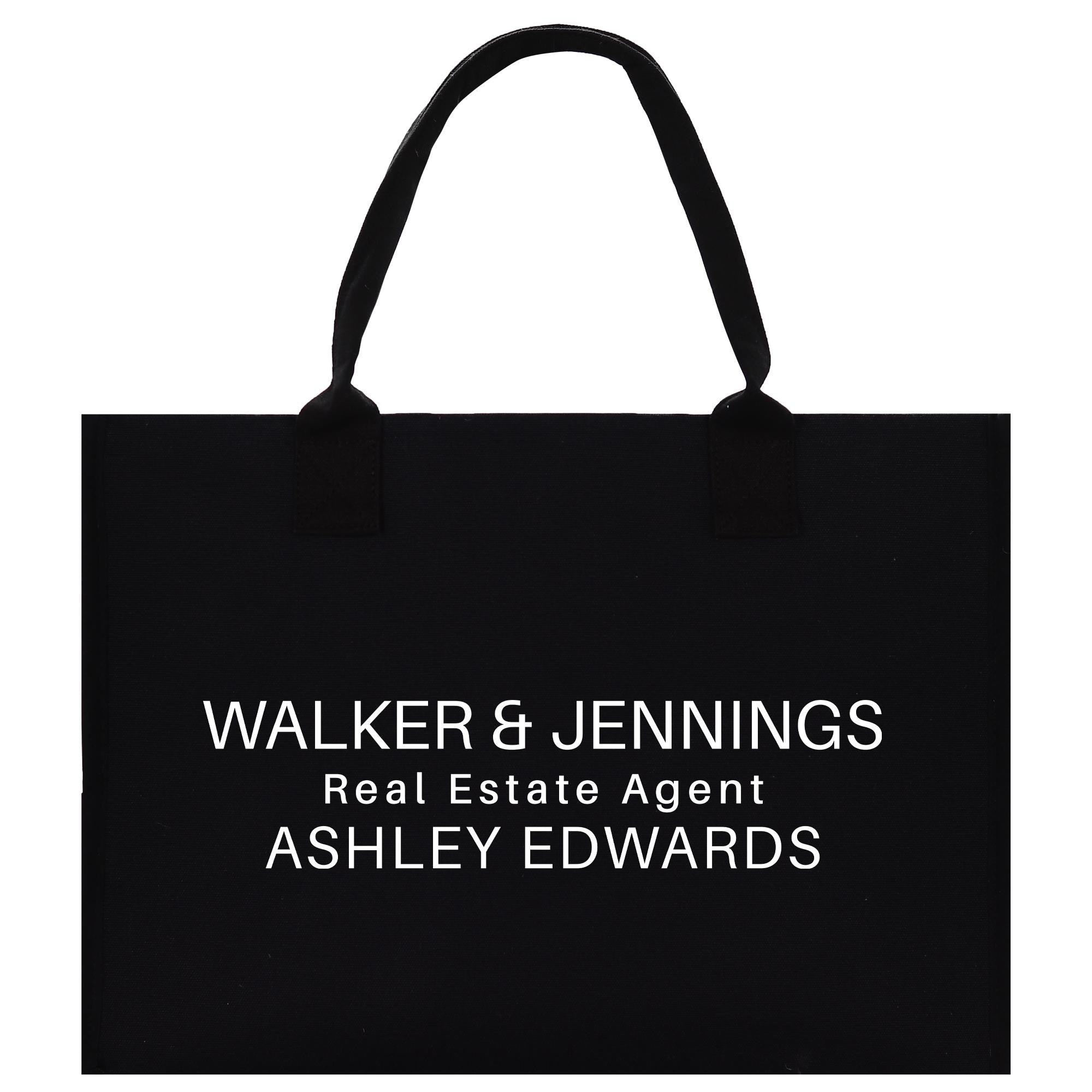 A black paper bag with white text printed on it.