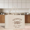 a white bag sitting on top of a wooden table