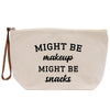 A beige canvas makeup bag with the text "MIGHT BE makeup MIGHT BE snacks" printed on it.
