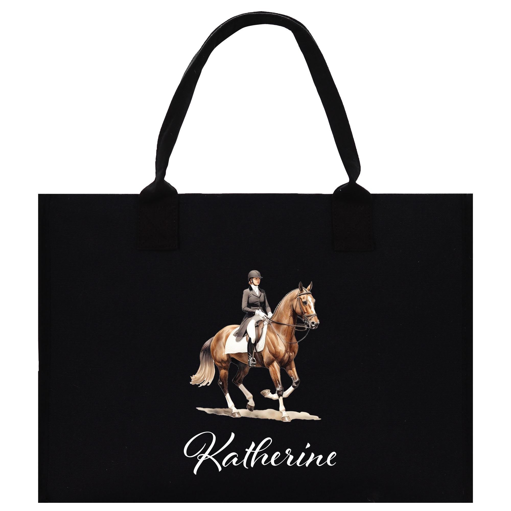 A black tote bag with a printed image of a person riding a horse on it.