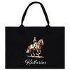 A black tote bag with a printed image of a person riding a horse on it.