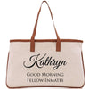 a white bag with brown handles and a brown handle