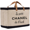 a black and white tote bag with the words le petit chanel de pearl