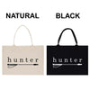 two bags, one natural and one black, with the word "hunter" printed on them.