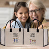 Two bags with text and illustrations, one bag says "FIRST MOM" and the other says "NOW GRAM", with illustrations of a family.