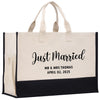 a black and white tote bag with the words just married printed on it