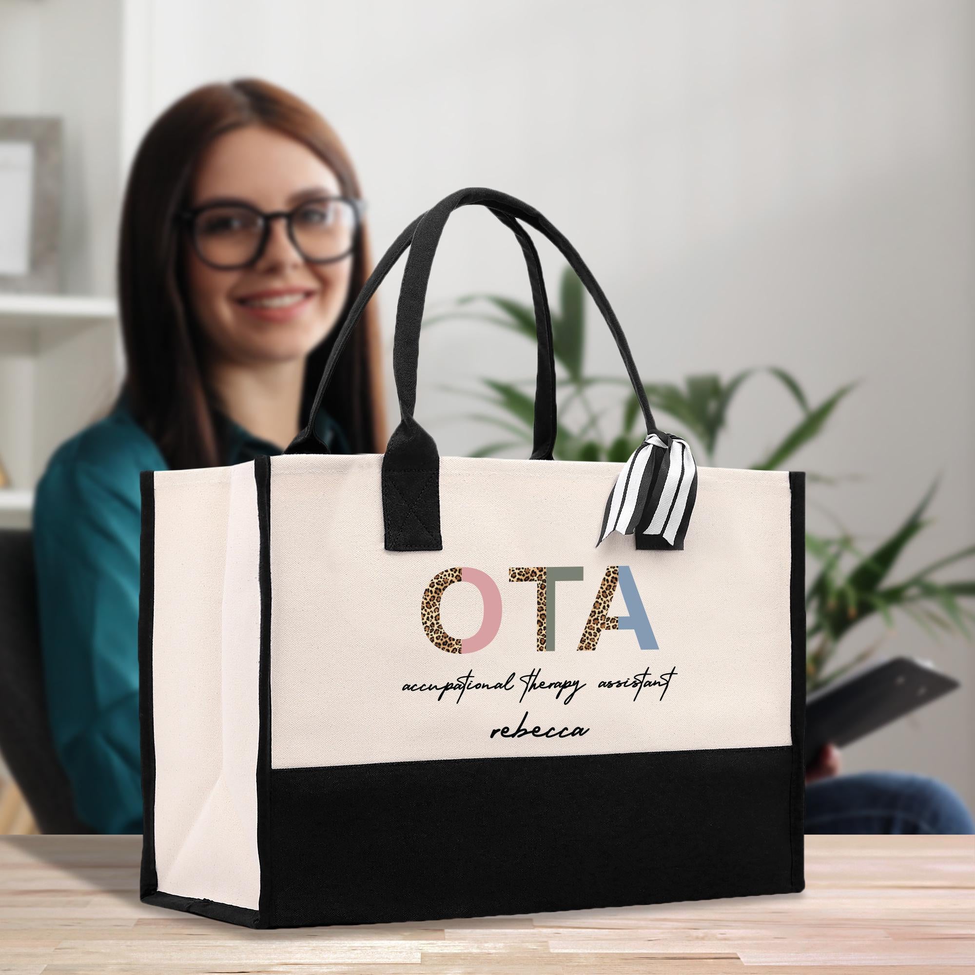 a woman sitting at a table with a black and white bag