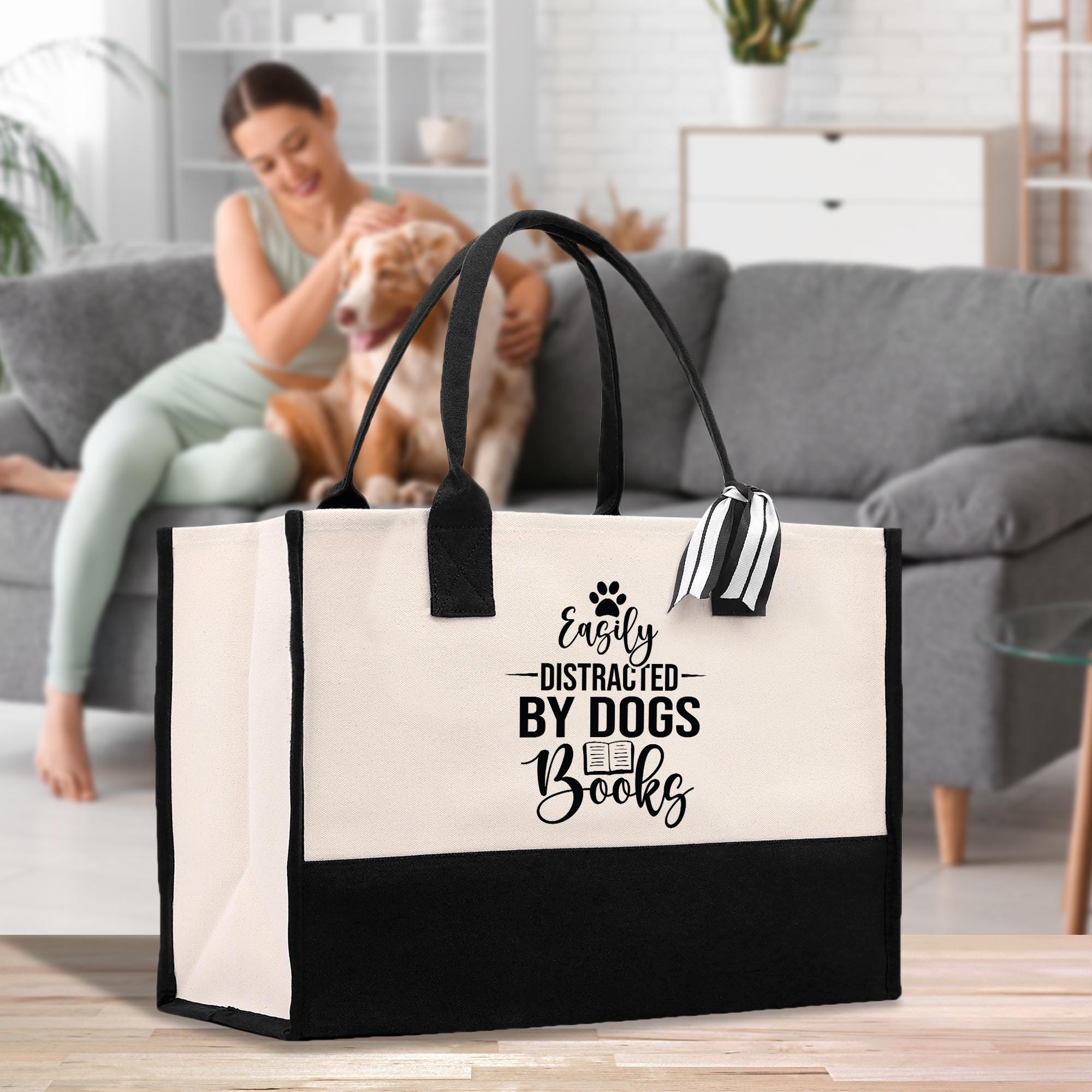 a woman sitting on a couch with a dog and a bag