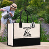 a woman is watering her garden with a watering can
