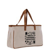 A beige canvas tote bag with a brown handle and straps, featuring a printed design on the front that says "SHELF OF UNFINISHED ADVENTURES".