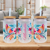 three personalized water bottles on a table in a living room