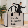 a woman in a black dress is dancing with a white bag