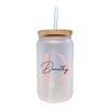 a white glass with a straw in it