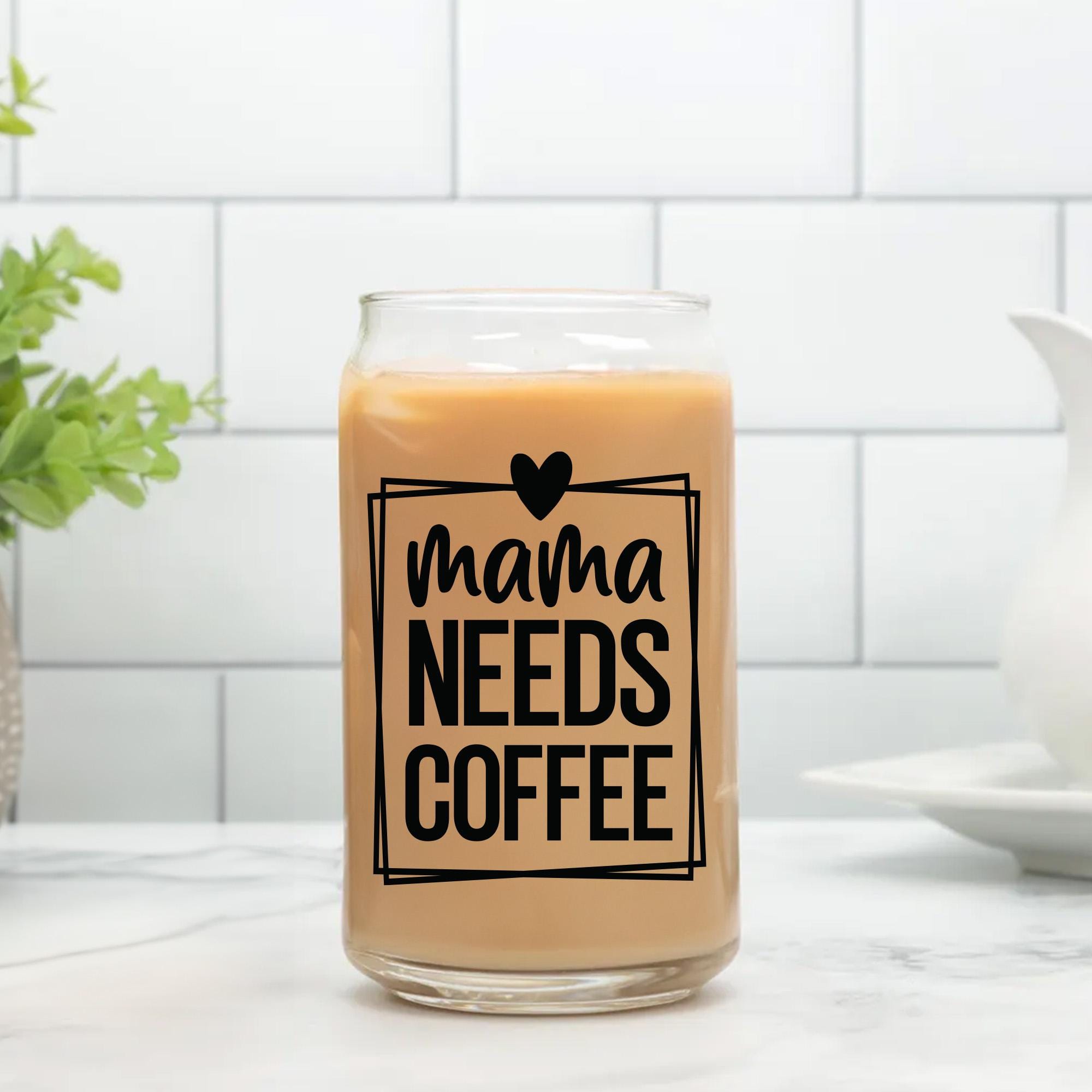 a glass jar filled with coffee sitting on top of a counter