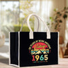 a black bag with a white handle on a table