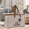 a canvas bag with a dandelion design on it