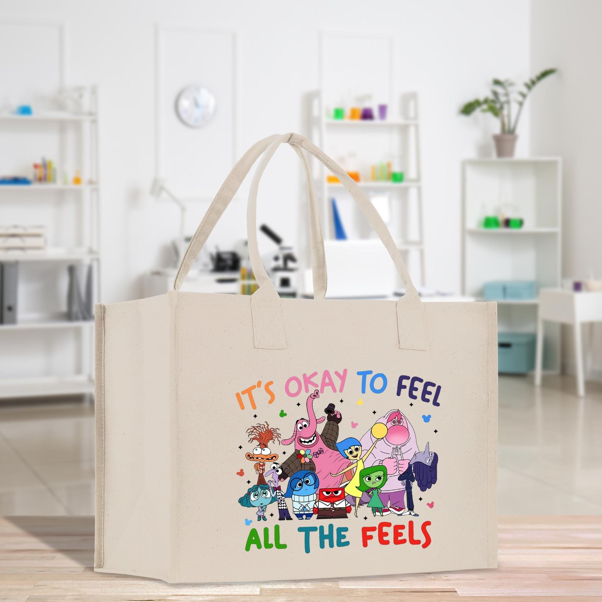 a canvas bag with the words it&#39;s okay to feel all the feels