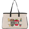 a white bag with a black handle and a picture of an apple