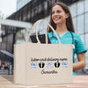 a woman holding a shopping bag that says labor and delivery nurse