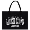 a black tote bag with a custom lake life location on it