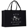 a black shopping bag with the words hair stylist on it