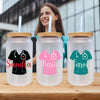 three personalized mason jars with straw tops on a table