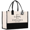 a black and white bag with a monogrammed handle