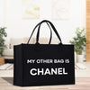 a black bag that says, my other bag is chanel
