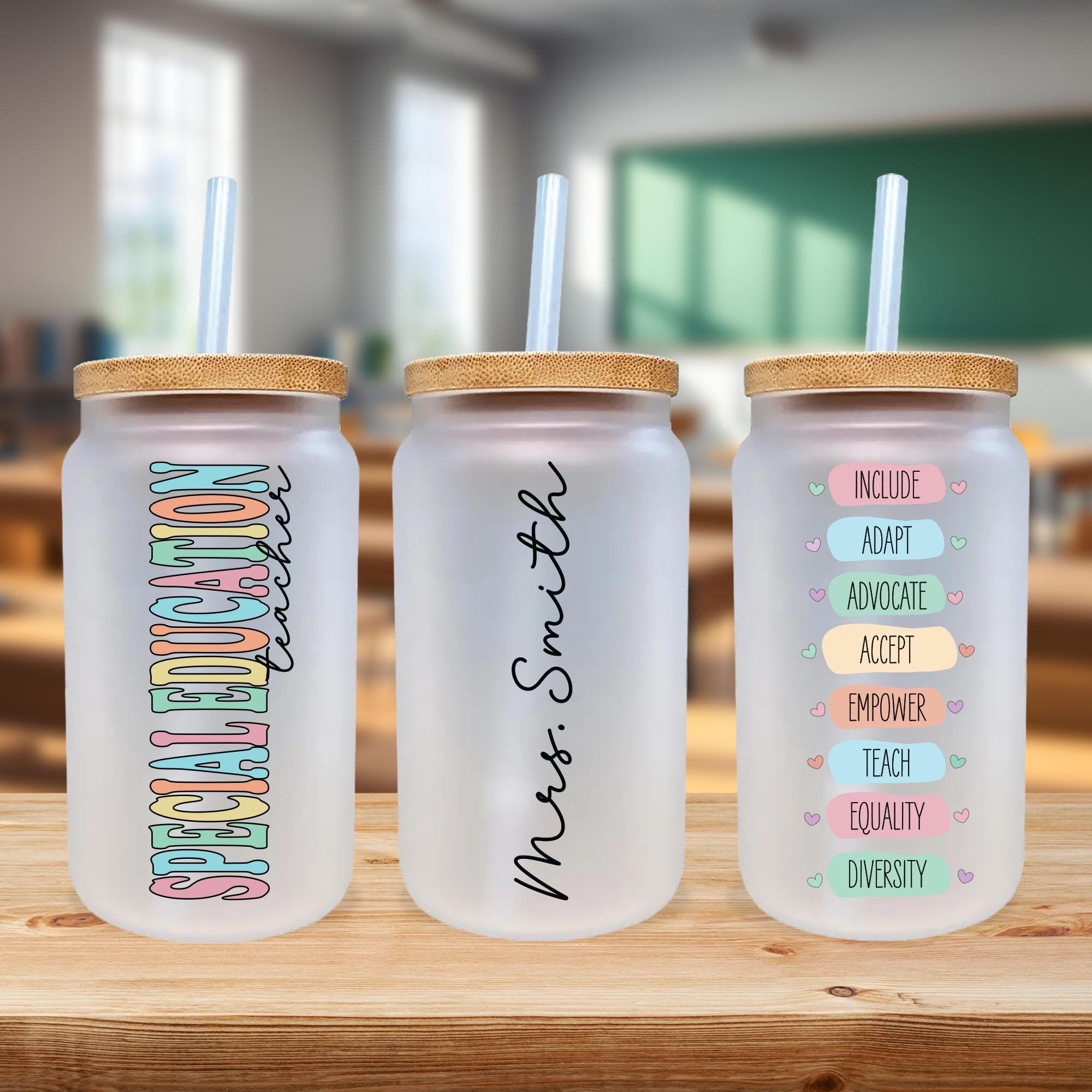 three personalized water bottles sitting on a table