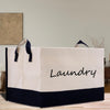 a laundry bag sitting on top of a wooden table