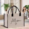 a woman sitting on a couch with a personalized shopping bag