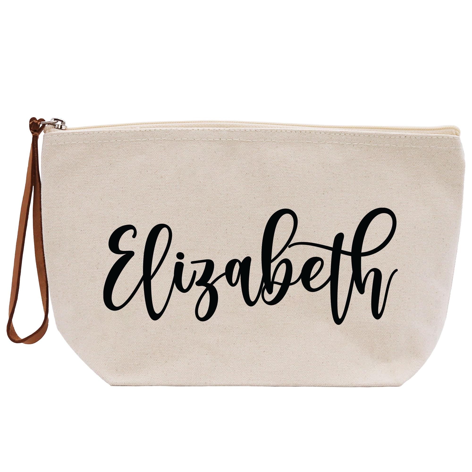 a white zippered bag with the word elizabeth printed on it