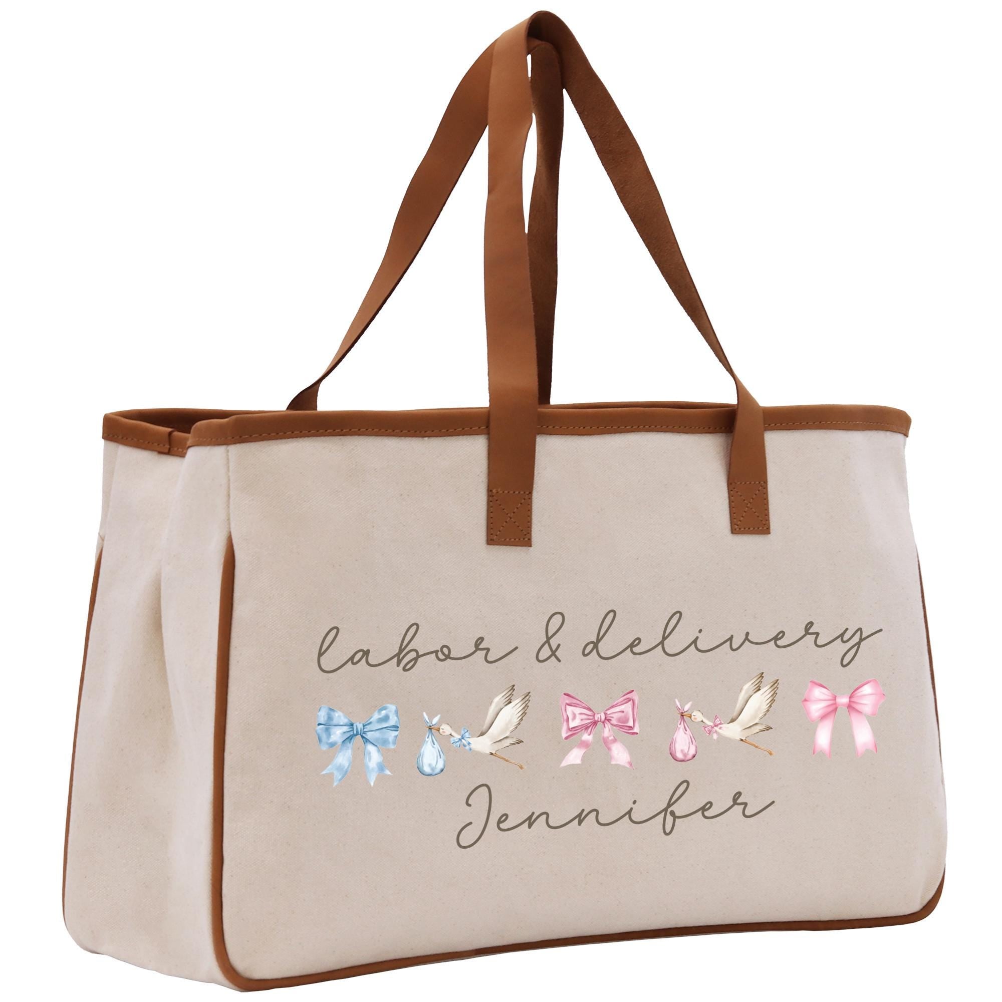 a white bag with a brown leather handle