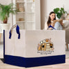 a woman sitting on a couch reading a book while holding a shopping bag