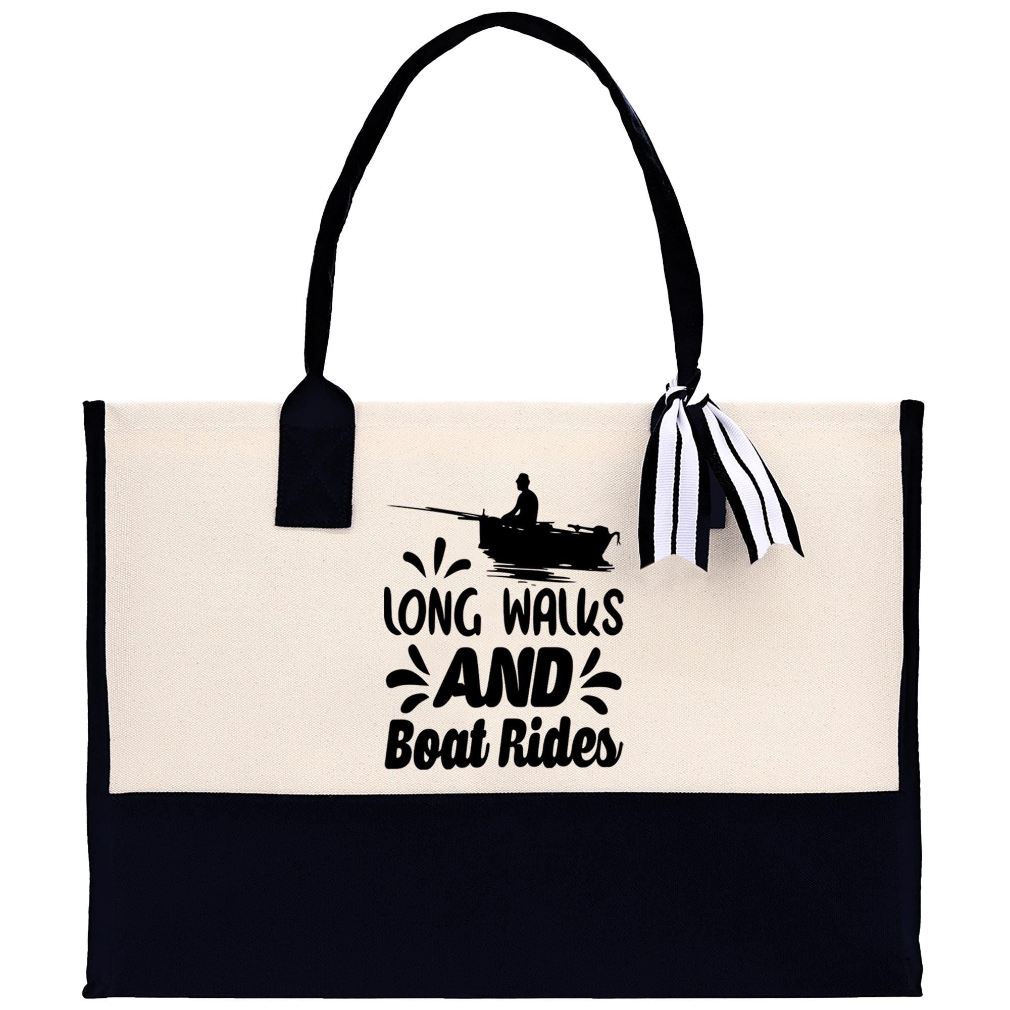 A tote bag with a black and white design featuring a silhouette of a person rowing a boat and the text "LONG WALKS AND Boat Rides" printed on it.