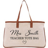 a white bag with a brown leather handle