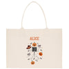 a white bag with a skeleton and pumpkins on it