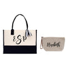 a white and black bag and a black and white purse