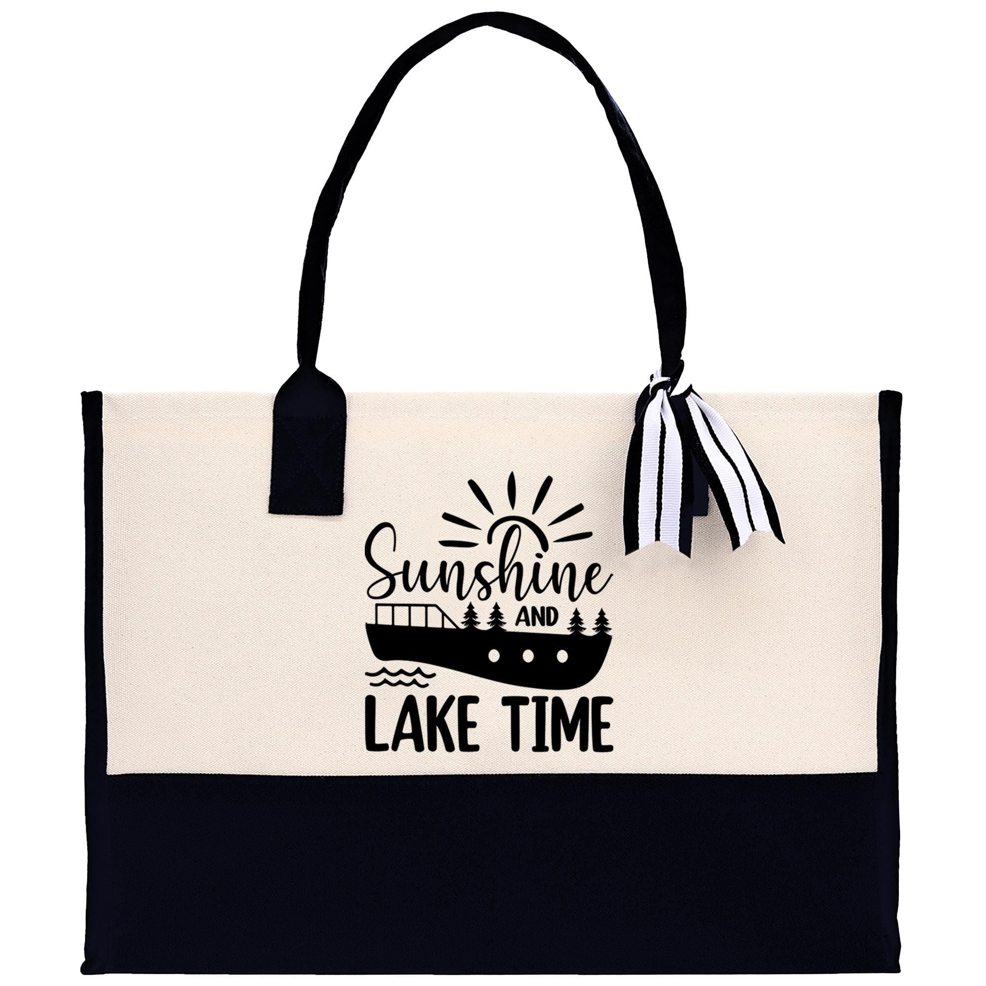A tote bag with a black and white design featuring a boat and the text "Sunshine and Lake Time".