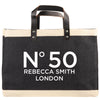 A black and beige tote bag with the text 