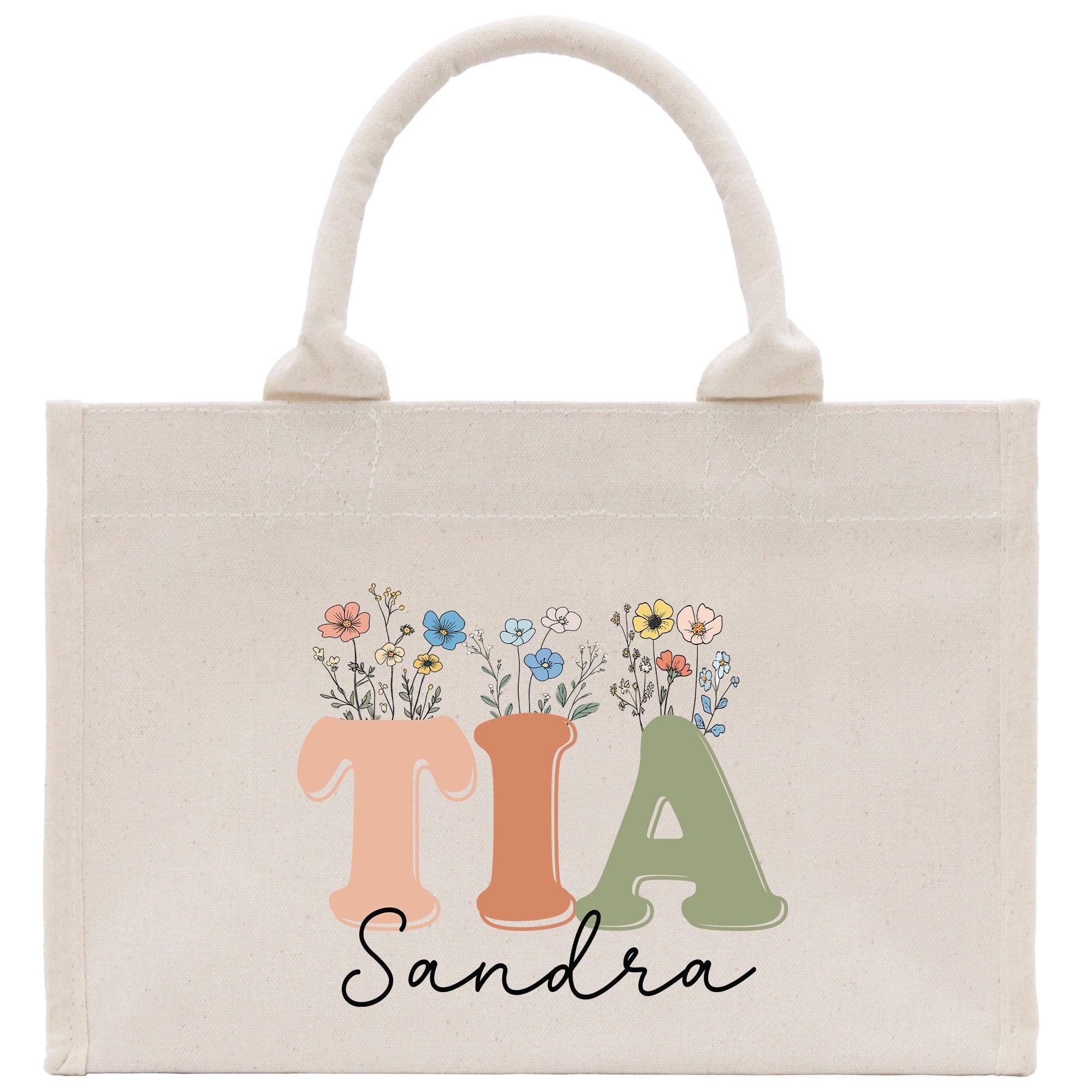 a canvas bag with the letter i a and flowers on it